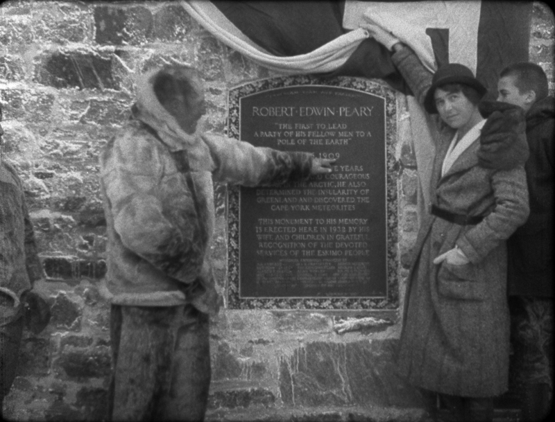 Bob Bartlett and Marie Peary Stafford unveil the dedication plaque on the Peary Monument, August 21, 1932.